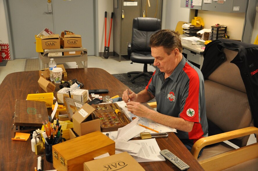 James Fish with the Heavy Repair-Locksmith shop repairs a lock. (U.S. Air Force photo / Gene Barnett)