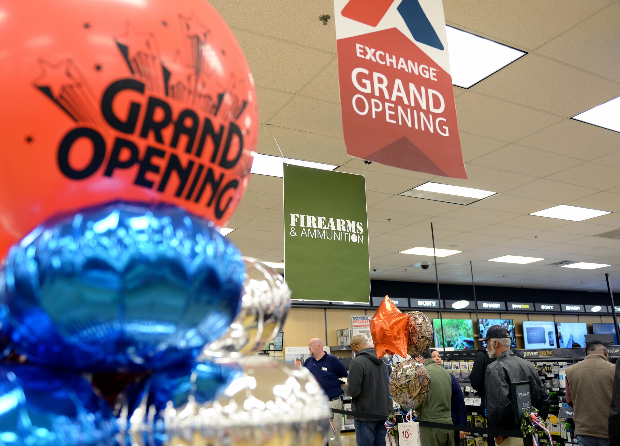 The Maxwell Base Exchange celebrates their grand opening of the firearms counter, Friday, Feb. 17, 2017. During the ceremony, cake and refreshments were provided and participants could enter a raffle for a chance to win a free firearm. (U.S. Air Force photo/Senior Airman Tammie Ramsouer)