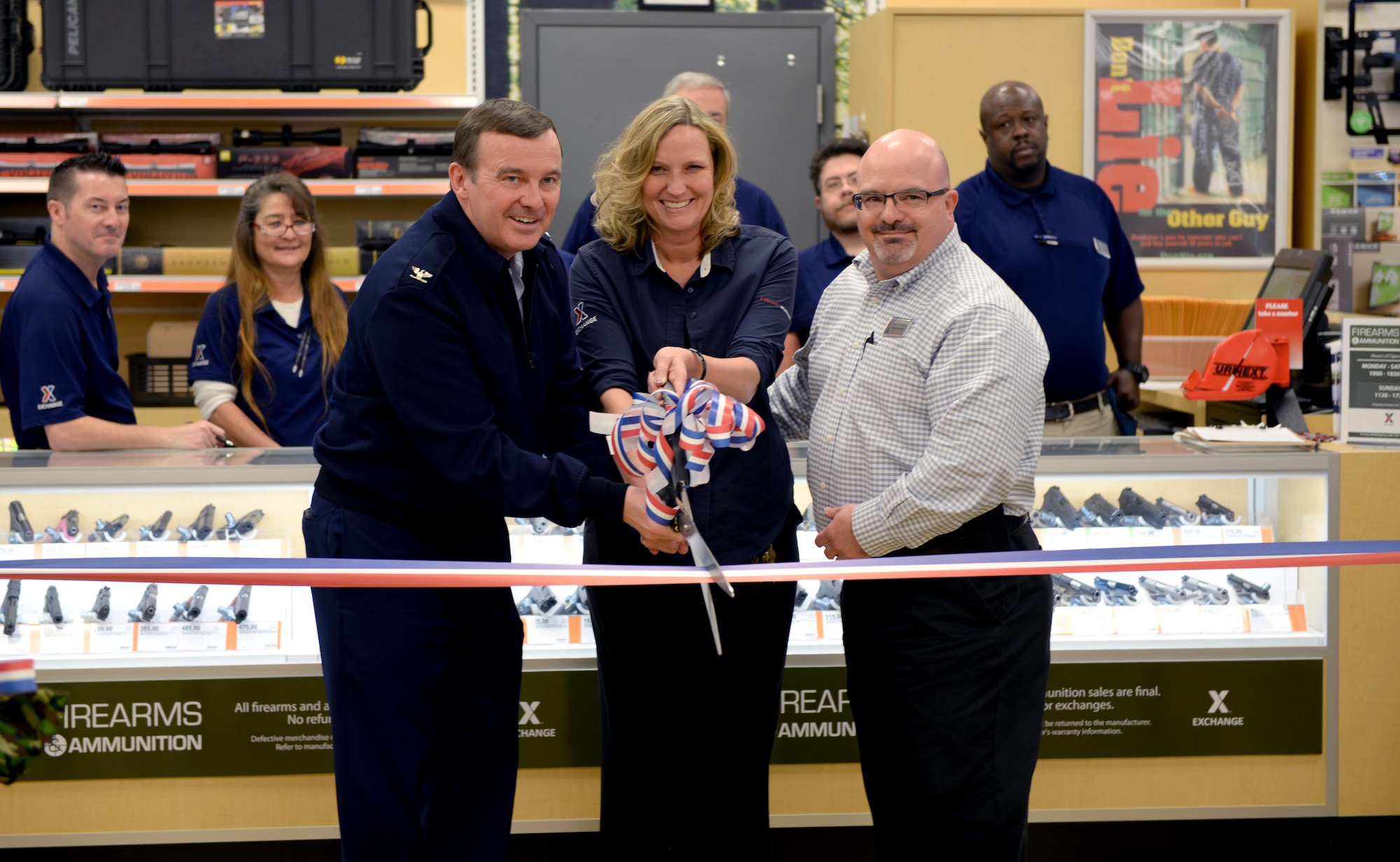 Col. Donald Lewis, 42nd Mission Support Group commander, Vanessa VanDamme, Maxwell Base Exchange store manager, and Ralph Kleemann, Maxwell Base Exchange general manager, open the new firearms counter with a ceremonial ribbon cutting, Friday, Feb. 17, 2017. During the ceremony, participants could enter a raffle for a chance to win a free firearm, as well as, cake and refreshments. (U.S. Air Force photo/Senior Airman Tammie Ramsouer)