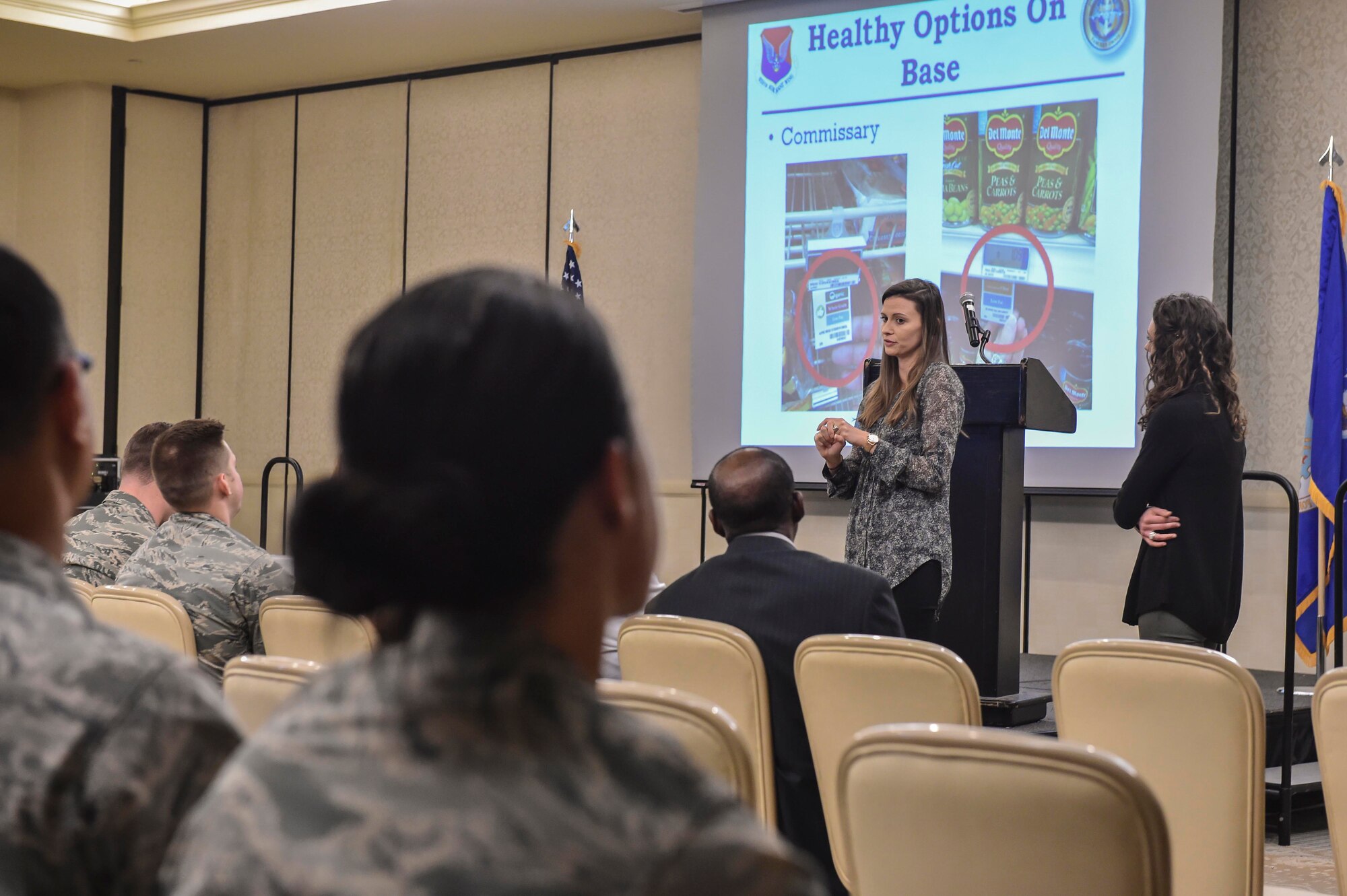 Alaine Mills, Health and Wellness Center health promotion dietitian, discusses healthy eating options on base during a Town Hall Meeting at the Charleston Club, Feb. 3. The Robert D. Gaylor Dining Facility will be closing March 1 for 10 months while repairs are made to the building. More than 400 Airmen living in the dormitories will receive basic allowance for subsistence (BAS) II, a total of $736.58 per month.