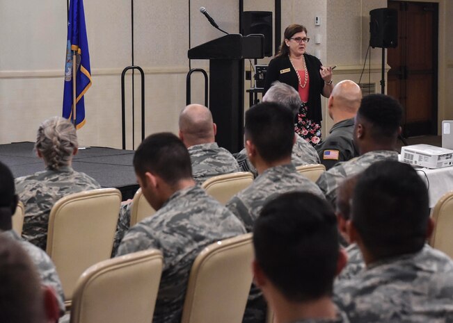 Barbara Lang, Airman and Family Readiness Center community readiness consultant, speaks about being financially responsible during a Town Hall Meeting at the Charleston Club, Feb. 3. Airmen will be receiving basic allowance for subsistence (BAS) II, a total of $736.58 per month, while the Robert D. Gaylor Dining Facility here is closed for repairs.