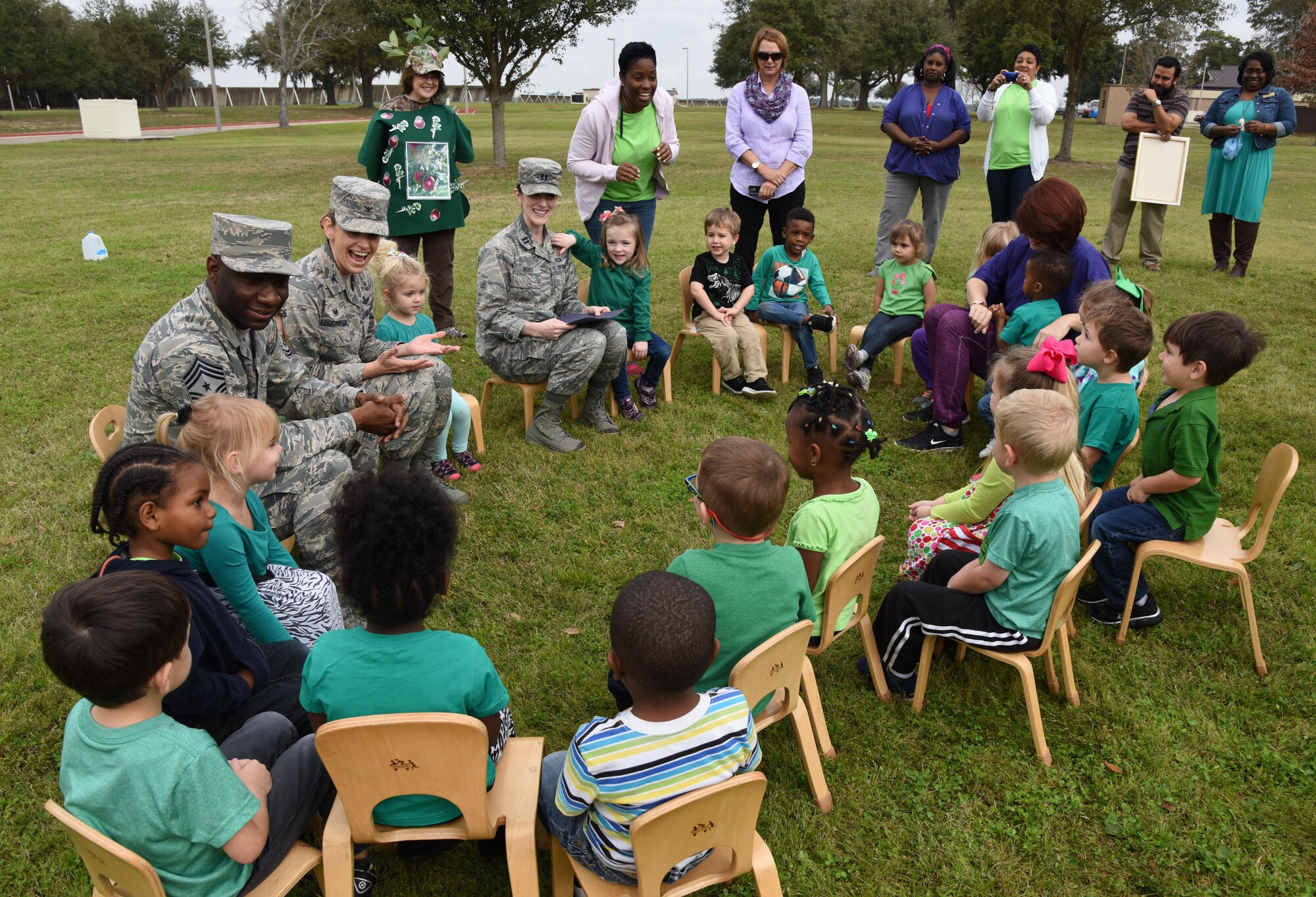 Col. Michele Edmondson, 81st Training Wing commander, and Chief Master Sgt. Vegas Clark, 81st TRW command chief, speak to children from the child development center at an Arbor Day celebration outside of the CDC Feb. 14, 2017, on Keesler Air Force Base, Miss. Keesler AFB earned the national Tree City USA honor from the Arbor Day Foundation for its 24th consecutive year. (U.S. Air Force photo by Kemberly Groue)