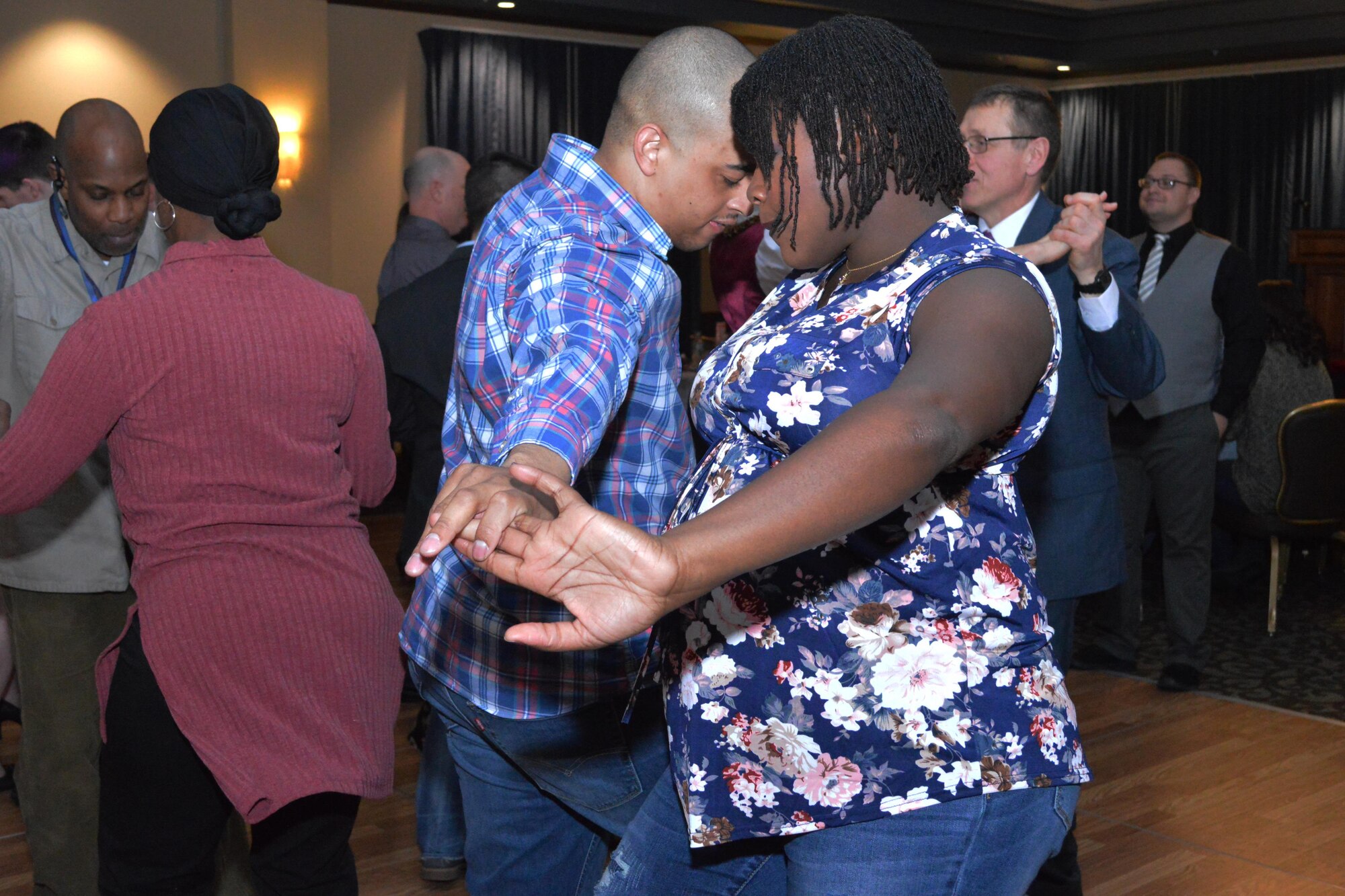 A couple dances the Rumba during the Sweetheart Dinner marriage enrichment event, Feb. 11, 2017, at the Red Morgan Center on Fairchild Air Force Base, Washington. This event was one way the Fairchild AFB Chaplain Corps strives to promote a healthy, resilient community by providing quality of life programs that enhance the development and readiness of Airmen and their families. (U.S. Air Force Photo/Capt. David Liapis)