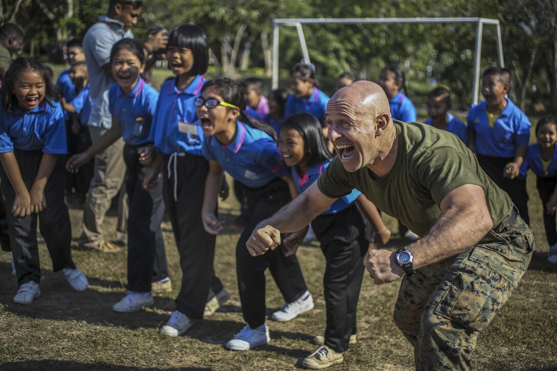 Marine Corps Master Sgt. Jeisson Manzifortich plays a game with students during Cobra Gold at the Juksamed School in Thailand, Feb. 8, 2017. The exercise focuses on supporting the humanitarian and medical needs of communities in the region. Marine Corps photo by Cpl. Wesley Timm
