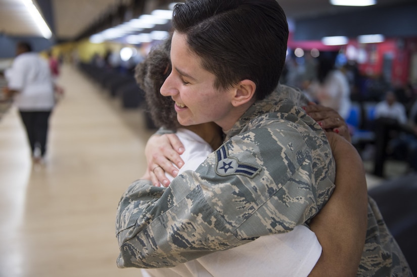 Airman 1st Class Autumn Payne, 779th Medical Support Squadron medical logistics personnel, hugs Tina Johnson, District of Columbia Special Olympics athlete, after knocking down pins during the 2017 D.C. Special Olympics Bowling Championship at Hyattsville, Md., Feb. 16, 2017. Volunteers were encouraged to help with equipment, keep score, get to know the athletes and cheer them on throughout the tournament. (U.S. Air Force photo by Senior Airman Philip Bryant)