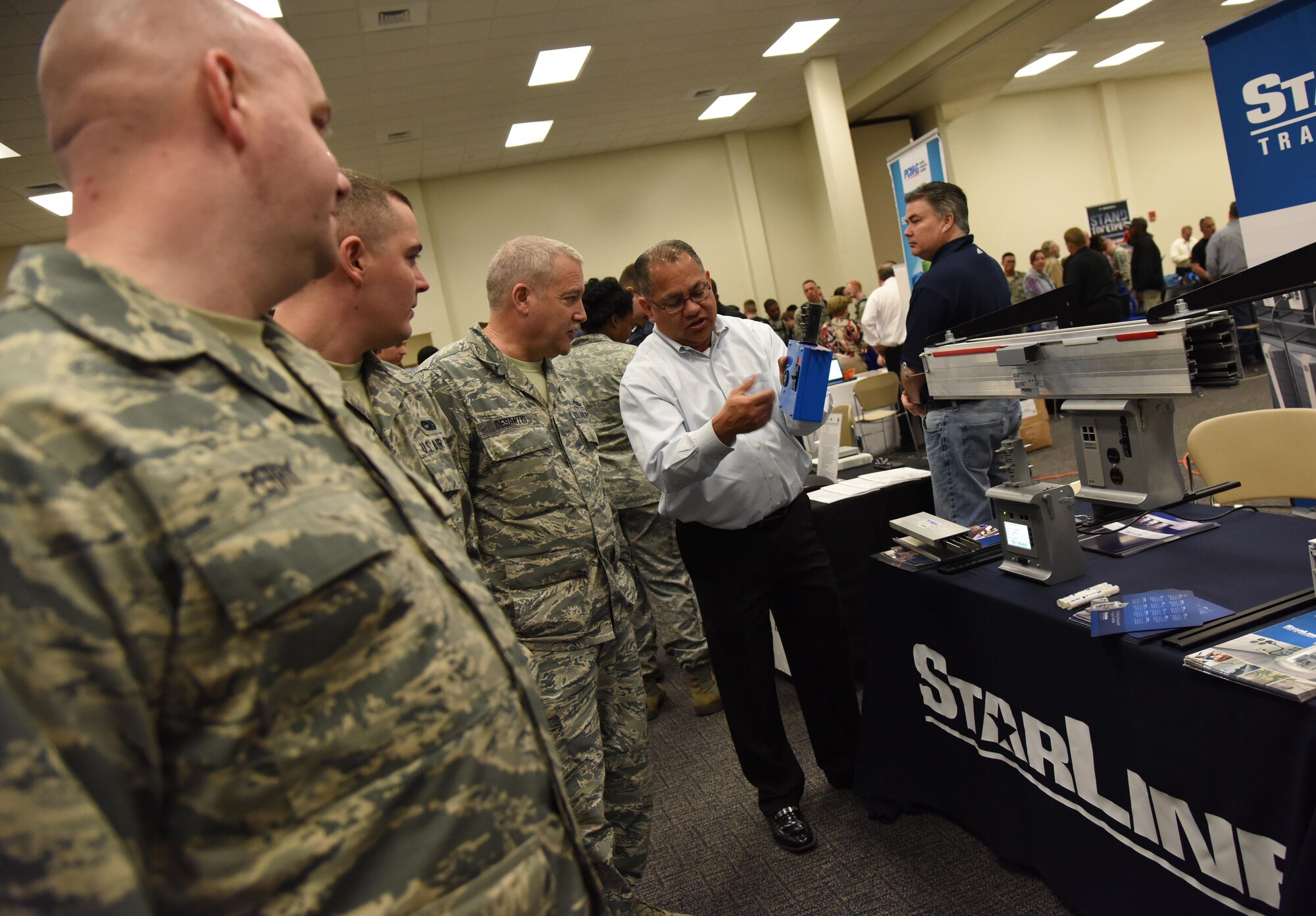 Johnny Gonzales, StarLine regional sales manager, gives an equipment brief on power monitoring to Keesler personnel during the 22nd annual Technology Expo at the Roberts Consolidated Aircraft Maintenance Facility Feb. 14, 2017, on Keesler Air Force Base, Miss. The 81st Communications Squadron hosted the free event open to all Defense Department, government and contractor personnel with base access. (U.S. Air Force photo by Kemberly Groue)