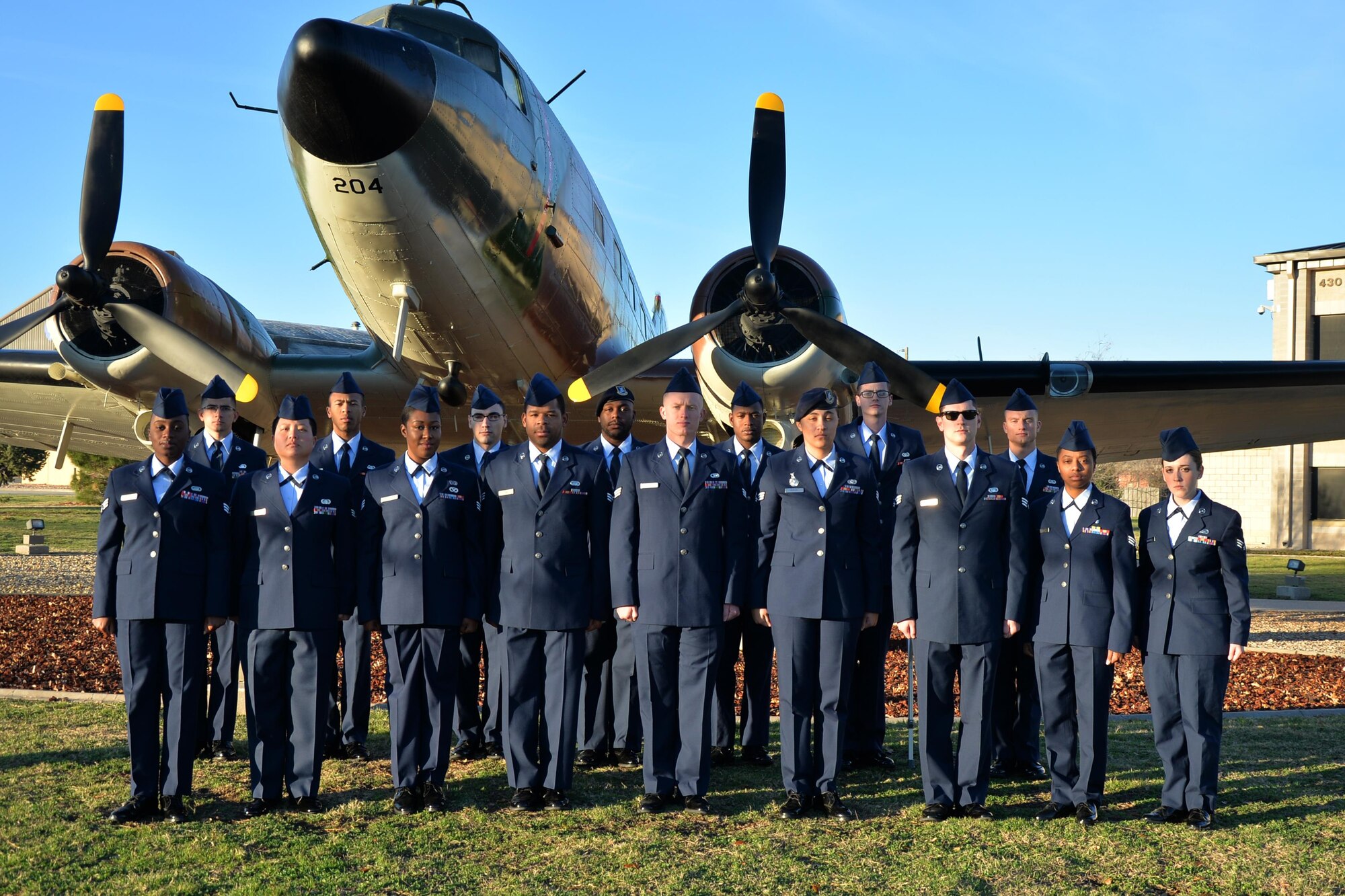 Airman leadership school class 17-B stands before a static plane display on Goodfellow Air Force Base, Texas, Feb, 15, 2017. ALS is a 6-week course designed to prepare senior airmen to assume supervisory duties, offering instruction in the practice of leadership and followership, written and oral communicative skills, and the profession of arms. (U.S. Air Force photo by Airman 1st Class Randall Moose/Released)