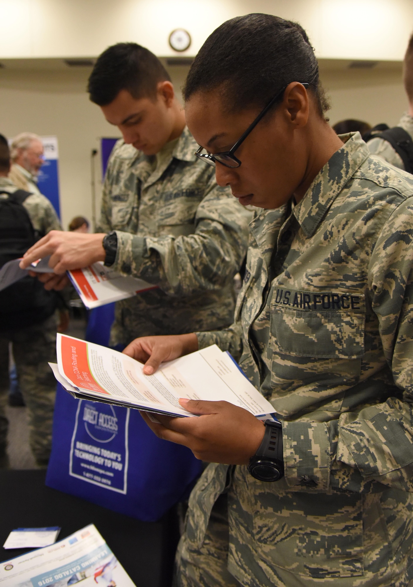 Airman 1st Class Kathryn Crittenden, 336th Training Squadron student, reviews a brochure during the 22nd annual Technology Expo at the Roberts Consolidated Aircraft Maintenance Facility Feb. 14, 2017, on Keesler Air Force Base, Miss. The 81st Communications Squadron hosted the free event open to all Defense Department, government and contractor personnel with base access. (U.S. Air Force photo by Kemberly Groue)