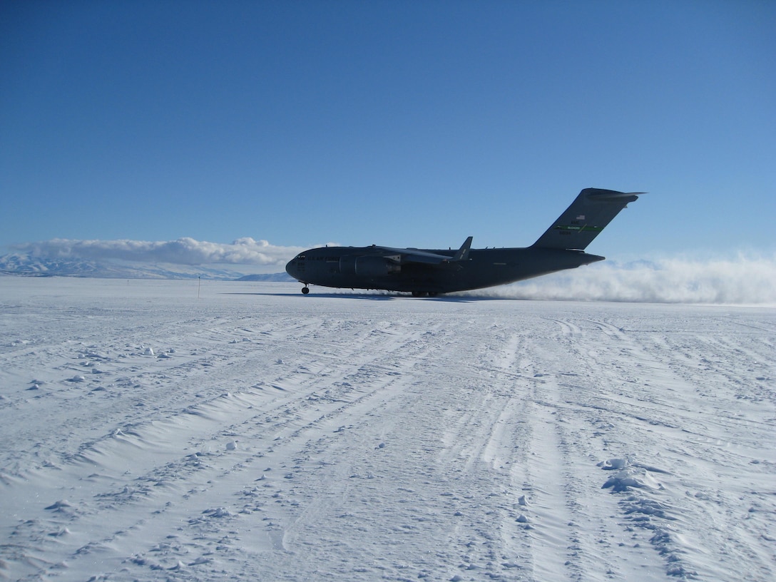 A McChord Air Force Base C-17 Globemaster III, a cargo and transport aircraft used by air forces around the world, takes flight from the new Antarctic deep-snow runway, the Phoenix, during a test run.