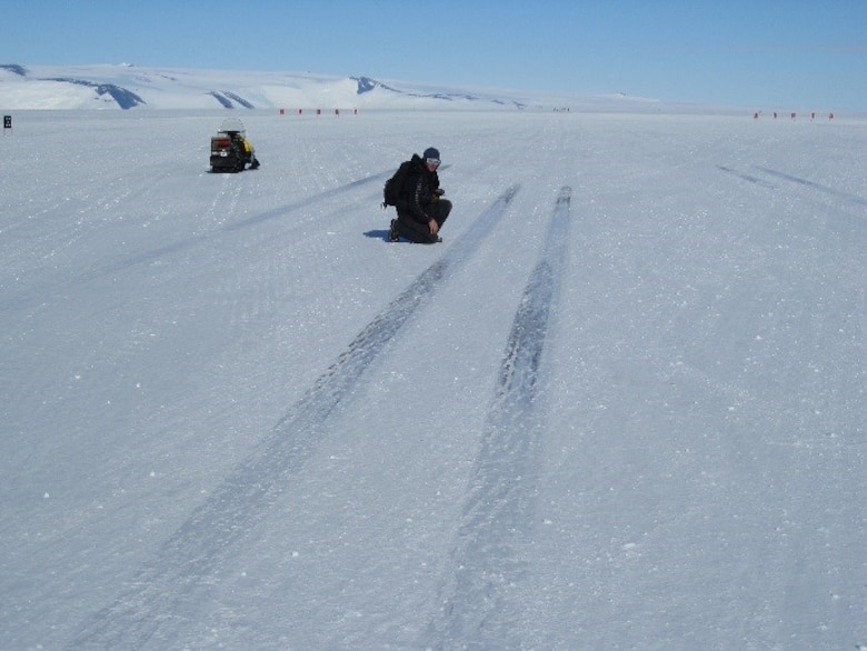 U.S. Army Engineer Research and Development Center’s Terry Melendy recently measures aircraft wheel friction patterns between takeoffs and landings left by the heavy C-17s on the newly constructed Phoenix runway in Antarctica.