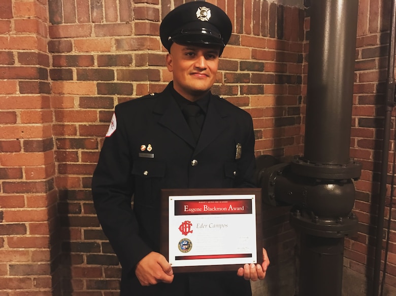 Candidate Firefighter and Emergency Medical Technician Eder Campos, Marine veteran, graduated from the Fire Academy Feb. 15, 2017, at the Aon Grand Ballroom on the Navy Pier in Chicago, Ill. Campos was awarded the Eugene Blackmon award recognizing outstanding leadership. (U.S. Marine Corps photo by Cpl. Jennifer Webster/Released)