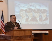 Lt. Col. Paul Castillo, 341st Missile Wing Chaplain, discusses the history of the Four Chaplains at a memorial service held at the base chapel Feb. 17, 2017 at Malmstrom Air Force Base, Mont. during his welcoming remarks.  The ceremony was held in remembrance of four chaplains that served on an Army transport ship, the Dorchester, in World War II.  The ship was torpedoed by a German U-boat Feb. 2, 1943, in the North Atlantic Ocean while traveling to Greenland.  As the ship was rapidly sinking and the surviving crewmembers abandoned ship, the four chaplains maintained calm throughout the panicking soldiers, even giving up their own life preservers in the process.  Ultimately, the chaplains perished within the icy waters of the Atlantic as the ship sank.  (Air Force photo/Jason Heavner)