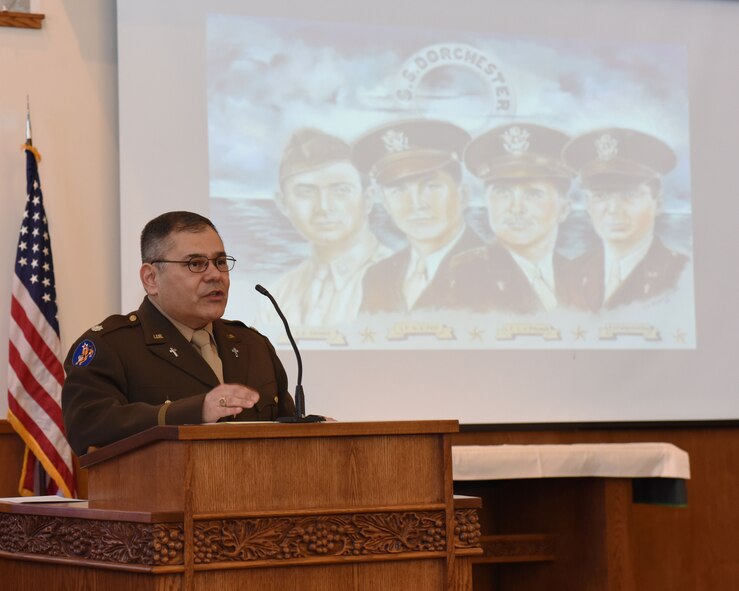 Lt. Col. Paul Castillo, 341st Missile Wing Chaplain, discusses the history of the Four Chaplains at a memorial service held at the base chapel Feb. 17, 2017 at Malmstrom Air Force Base, Mont. during his welcoming remarks.  The ceremony was held in remembrance of four chaplains that served on an Army transport ship, the Dorchester, in World War II.  The ship was torpedoed by a German U-boat Feb. 2, 1943, in the North Atlantic Ocean while traveling to Greenland.  As the ship was rapidly sinking and the surviving crewmembers abandoned ship, the four chaplains maintained calm throughout the panicking soldiers, even giving up their own life preservers in the process.  Ultimately, the chaplains perished within the icy waters of the Atlantic as the ship sank.  (Air Force photo/Jason Heavner)