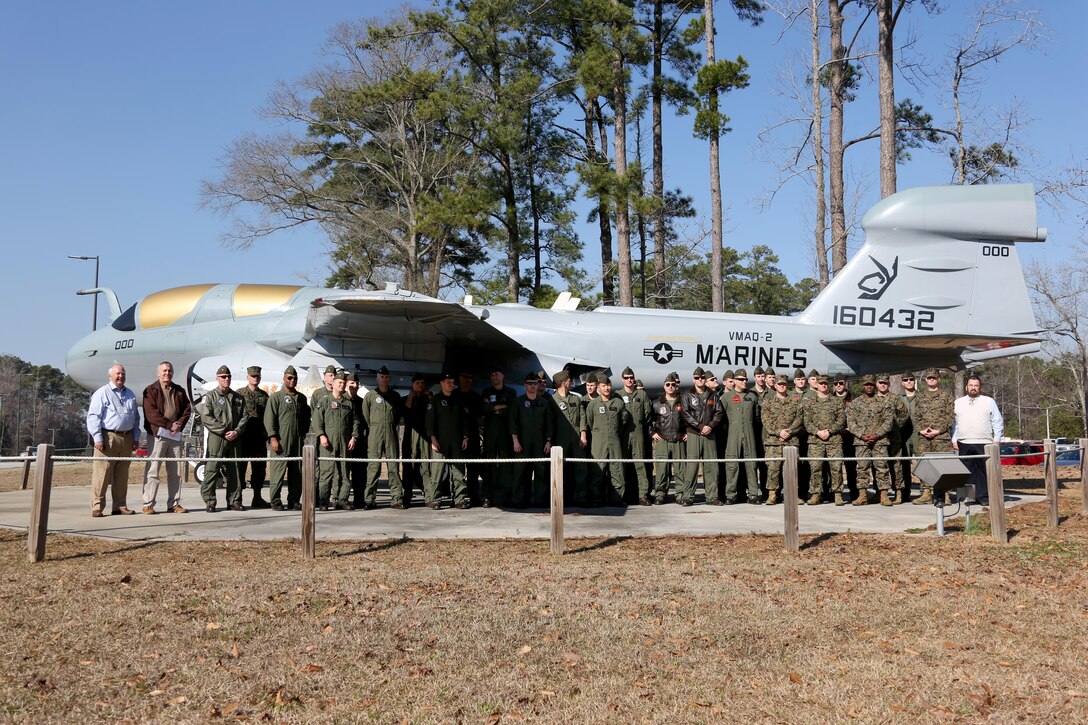 Marines assigned to various Marine Tactical Electronic Warfare Squadrons come together in honor of the 40th anniversary of the EA-6B Prowler during a commemoration ceremony held aboard Marine Corps Air Station Cherry Point, N.C., Feb. 17, 2017. The primary mission of the Prowler is suppression of enemy air defenses in support of strike aircraft and ground troops by interrupting enemy electronic activity and obtaining tactical electronic intelligence within the combat area. The VMAQ squadrons will be operating until their sundown in 2019 when the final Prowler will be transitioned out of the Marine Corps.  (U.S. Marine Corps photo by Cpl. Jason Jimenez/ Released)