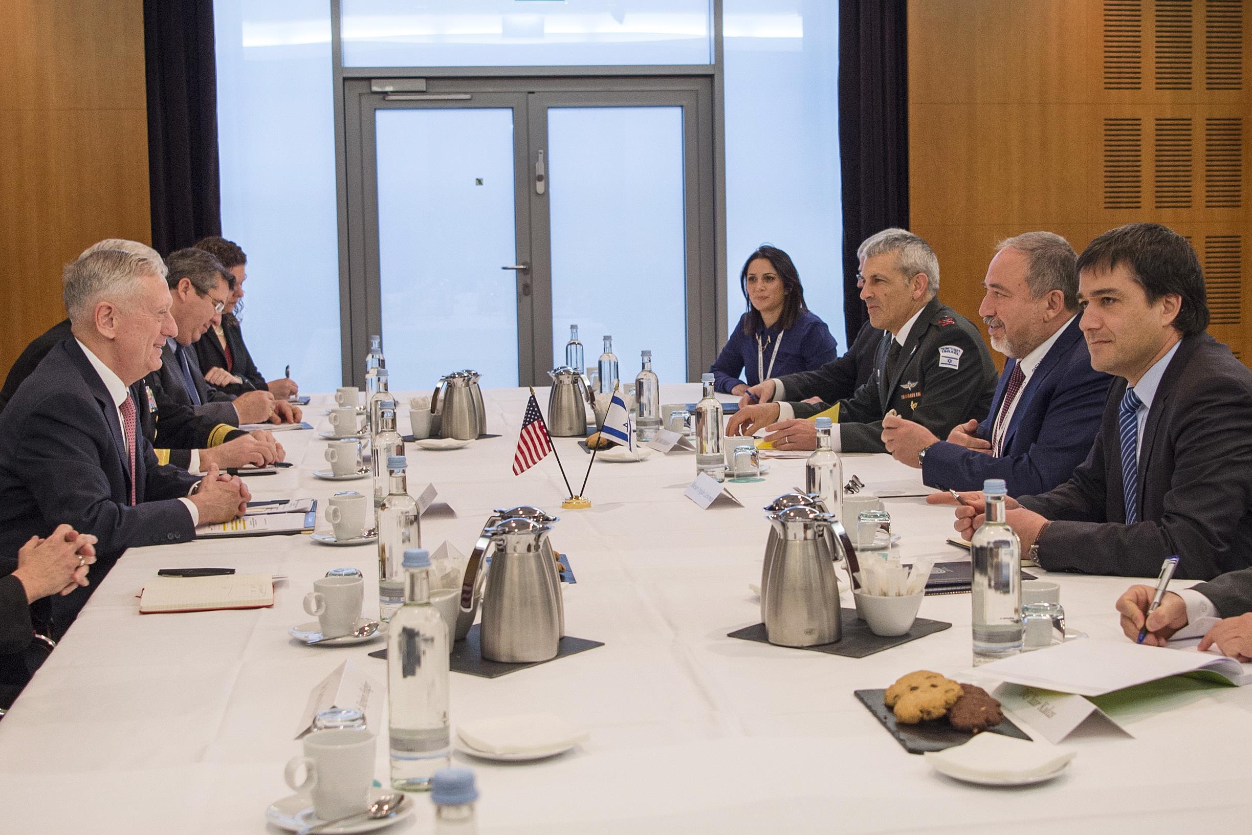 Defense Secretary Jim Mattis, center left, speaks during a Global Coalition to Counter ISIS meeting.