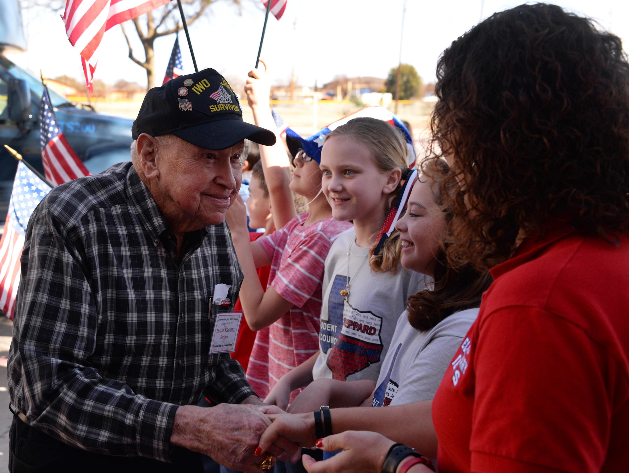 Iwo Jima survivors are greeted by children on Sheppard Air Force Base, Texas, Feb. 17, 2017. Children from Sheppard Elementary School met with WWII veterans during the Iwo Jima survivors 72nd Reunion. (U.S. Air Force photo by Senior Airman Robert L. McIlrath/Released)