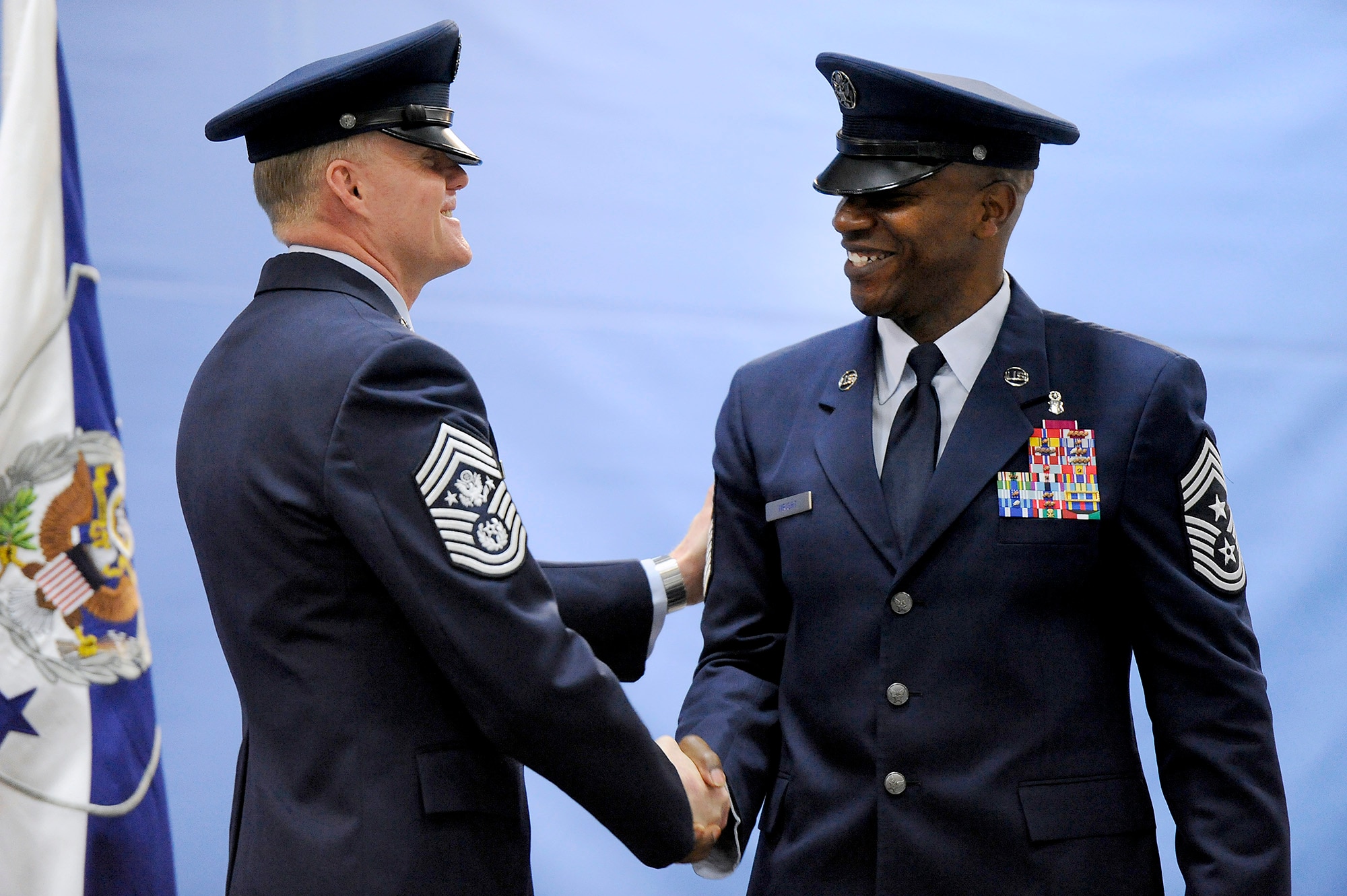 Chief Master Sgt. of the Air Force James A. Cody congratulates his successor, Chief Master Sgt. of the Air Force Kaleth O. Wright, during their retirement and appointment ceremony on Joint Base Andrews, Md., Feb. 17, 2017. Wright succeeds Chief Master Sgt. of the Air Force James A. Cody, who retires after 32 years of service, and he is the 18th Airman to hold this position. (U.S. Air Force photo/Tech. Sgt. Robert Barnett)