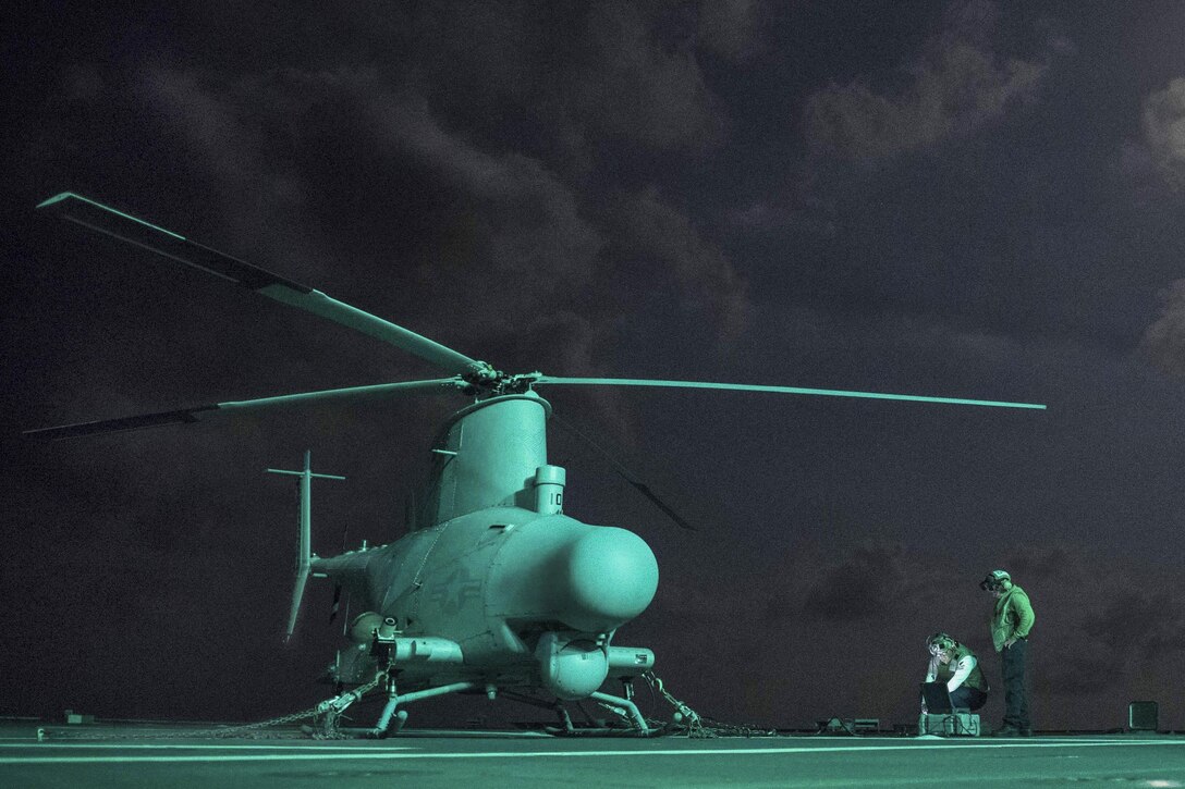 Sailors prepare an MQ-8B MQ-8B Fire Scout unmanned helicopter before performing ground turns aboard the USS Coronado in the South China Sea, Feb. 10, 2017. Navy photo by Petty Officer 2nd Class Amy M. Ressler