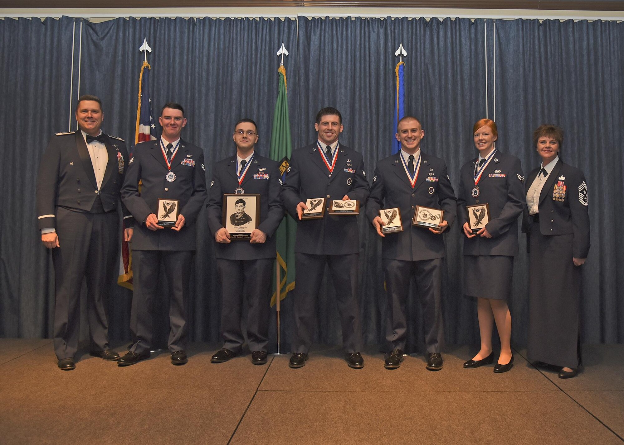 Airmen of Airman Leadership School Class 17 Bravo, who earned top honors, pose for a photo with Col. Matthew Fritz, 92nd Air Refueling Wing vice commander, and Chief Master Sgt. Shannon Rix, 92nd ARW command chief, Feb. 16, 2017, at Fairchild Air Force Base, Washington. ALS is a five-week course that focuses on leadership abilities, profession of arms and effective communication in the workplace. (U.S. Air Force photo/Senior Airman Mackenzie Richardson)