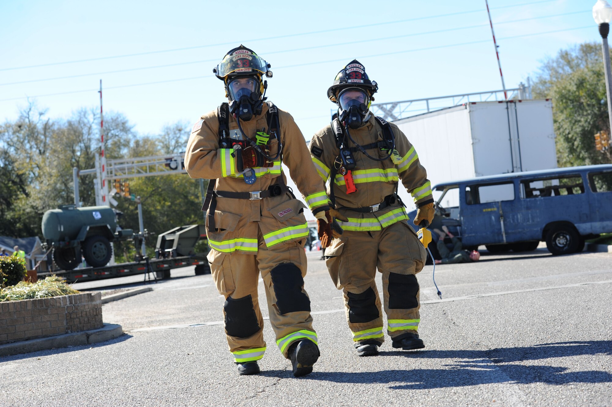Tech. Sgt. Justin King and Chad Martin, 81st Infrastructure Division firefighters, conduct initial entry and recon operations of the accident site during a train derailment exercise Feb. 16, 2017, on Keesler Air Force Base, Miss. The exercise scenario simulated a train and vehicle collision, which resulted in a derailment and chemical spill, creating a mass casualty and HAZMAT response event. This exercise tested base and local civilian emergency response organizations’ ability to operate in a multi-agency and multi-jurisdiction crisis situation. (U.S. Air Force photo by Kemberly Groue)