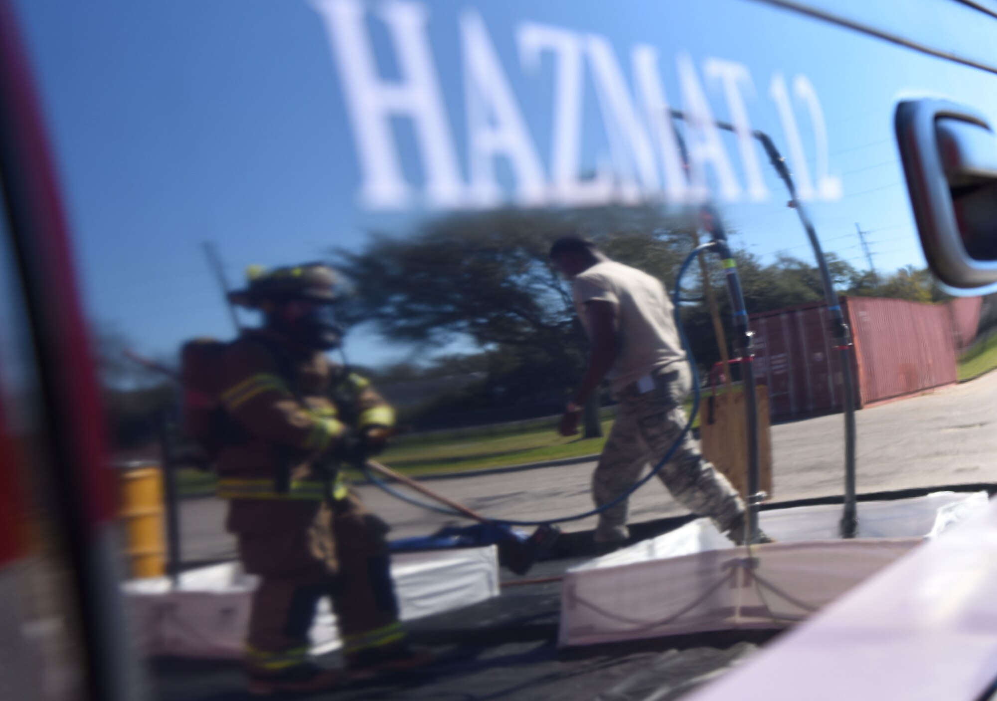 An 81st Infrastructure Division firefighter follows decontamination procedures on 2nd Lt. Jared Hines, 81st Contracting Squadron contract specialist, as he portrays a contaminated “victim” during a train derailment exercise Feb. 16, 2017, on Keesler Air Force Base, Miss. The exercise scenario simulated a train and vehicle collision, which resulted in a derailment and chemical spill, creating a mass casualty and HAZMAT response event. This exercise tested base and local civilian emergency response organizations’ ability to operate in a multi-agency and multi-jurisdiction crisis situation. (U.S. Air Force photo by Kemberly Groue)