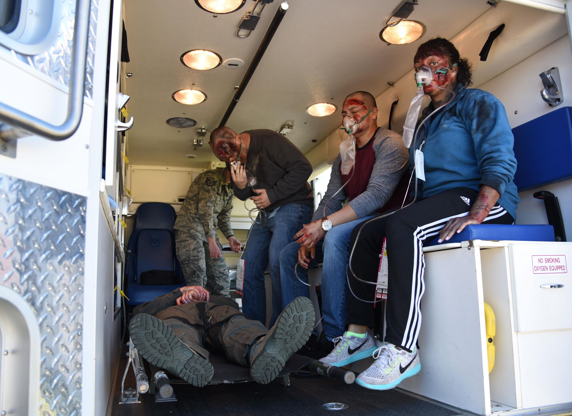 Keesler personnel portraying “victims” board an ambulance during a train derailment exercise Feb. 16, 2017, on Keesler Air Force Base, Miss. The exercise scenario simulated a train and vehicle collision, which resulted in a derailment and chemical spill, creating a mass casualty and HAZMAT response event. This exercise tested base and local civilian emergency response organizations’ ability to operate in a multi-agency and multi-jurisdiction crisis situation. (U.S. Air Force photo by Kemberly Groue)