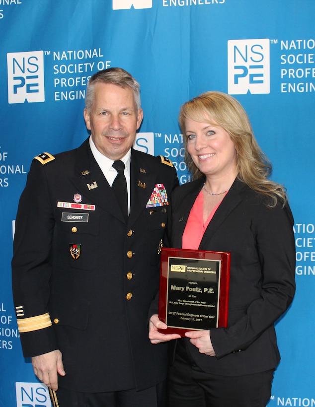 Mary Foutz, U.S. Army Corps of Engineers, Baltimore District Military Design Branch, Mechanical Section chief, holds agency winner award alongside Lt. Gen. Todd T. Semonite, chief of Engineers and commanding general of the Corps of Engineers, received during the Federal Engineer of the Year Award ceremony at the National Press Club in Washington, D.C., Feb. 17, 2017. (U.S. Army photo by Sarah Gross)