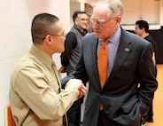 U.S. Marine Corps Director of Intelligence, Brig. Gen. William H. Seely III, shows his Oklahoma State University graduation ring to Burns Hargis, President of OSU near Gallagher-Iba Arena, Feb. 15. Seely also had the opportunity to speak to the number one ranked Cowboys wrestling team.