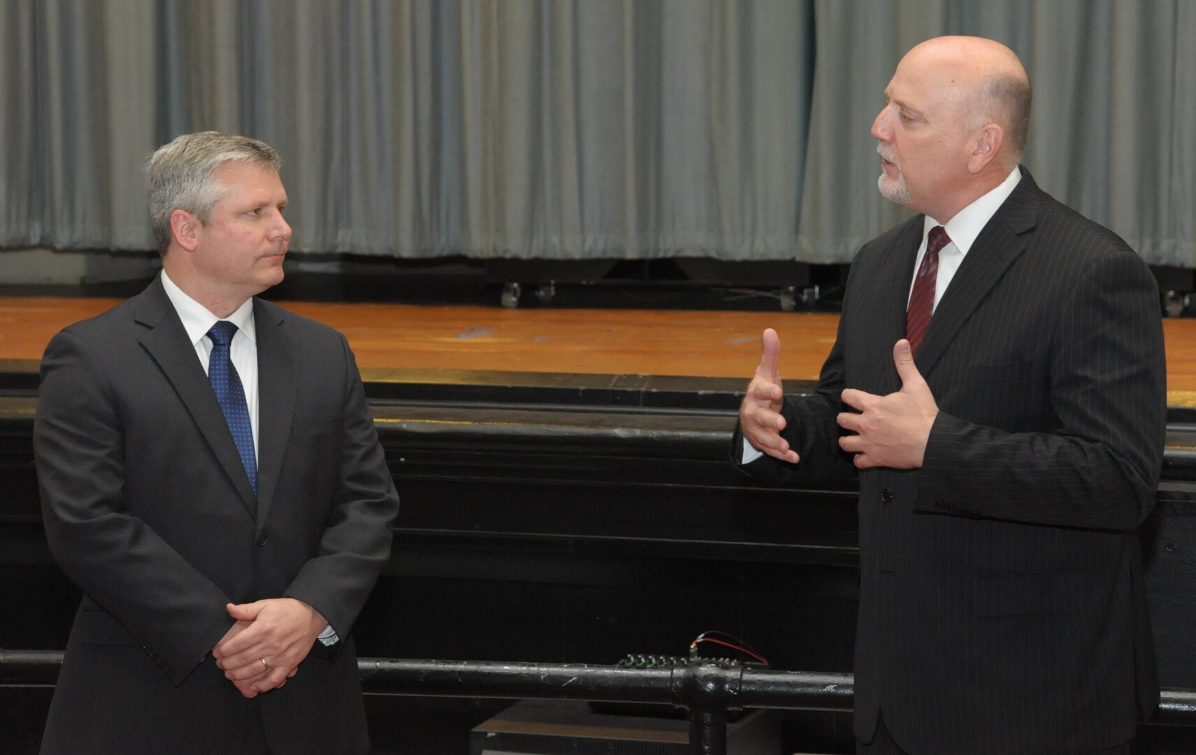 John Fedrico (R) deputy assistant Secretary of the Air Force for Reserve Affairs and Airman Readiness voices appreciation to retired Air Force Lt. Col. Todd Ernst (L), during a ceremony on Feb. 13 at Joint Base San Antonio-Randolph, Texas, for his efforts to get Survivor Benefit Program rules changed so that the families of Reserve and Guard service members receive the same benefits as active duty service members. (Air Force photo by Joel Martinez, Joint Base San Antonio-Randolph Public Affairs)

