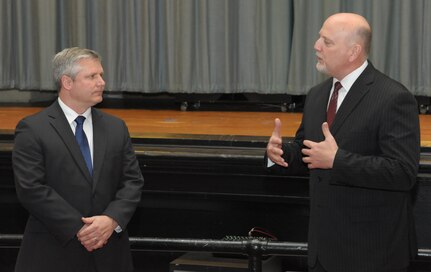 John Fedrico (R) deputy assistant Secretary of the Air Force for Reserve Affairs and Airman Readiness voices appreciation to retired Air Force Lt. Col. Todd Ernst (L), during a ceremony on Feb. 13 at Joint Base San Antonio-Randolph, Texas, for his efforts to get Survivor Benefit Program rules changed so that the families of Reserve and Guard service members receive the same benefits as active duty service members. (Air Force photo by Joel Martinez, Joint Base San Antonio-Randolph Public Affairs)

