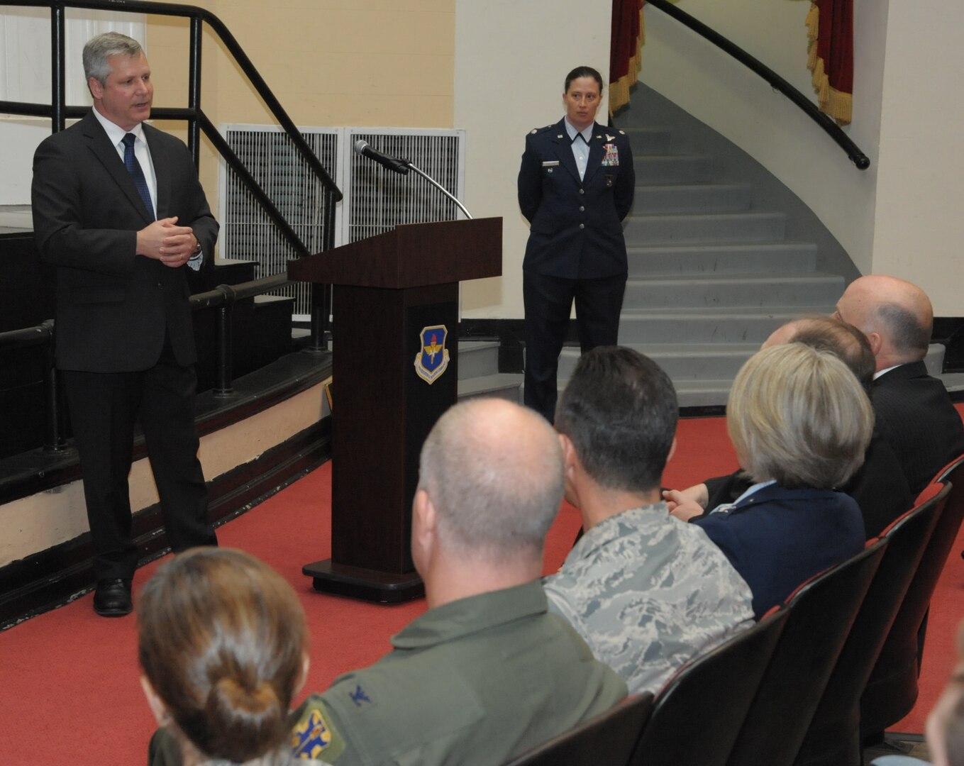 Retired Air Force Lt. Col. Todd Ernst shares memories of his friend Maj. Pete “Oly” Jahns with family and dignitaries at a ceremony on Feb. 13 at Joint Base San Antonio-Randolph, Texas honoring him for his efforts to get legislation changed to ensure Reserve and Guard families receive the same survivor benefits as active duty service members. Lt. Col. Courtney from the 39 FTS (background) provided opening and closing comments for the ceremony. Maj. Jahns perished on March 19, 2003, in a T-38 crash during a routine training flight at JBSA-Randolph. (Air Force photo by Joel Martinez, Joint Base San Antonio-Randolph Public Affairs)

