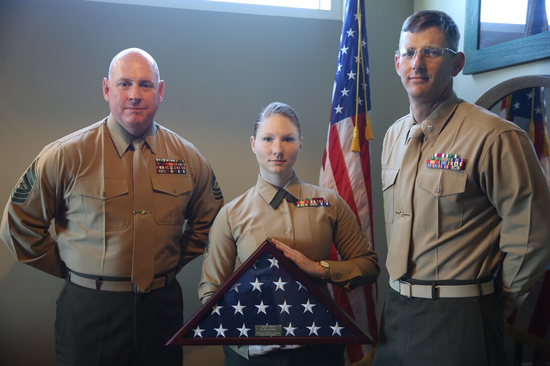 Sgt. Alicia Hojara, center, was awarded the Carteret County Chamber of Commerce’s Service Person of the Quarter award during an honorary luncheon in Emerald Isle, N.C., Feb. 10, 2017. Master Sgt. Christopher McGuire, left, and Lt. Col. Garrett Randel, right, nominated Hojara for her outstanding dedication to giving back to the local community. Hojara volunteers for multiple organizations including the Tragedy Assistance Program for Survivors that provides comfort and care for families who have lost a family member in the armed services. Randel is the commanding officer and McGuire is the aviation ordnance chief of the Center for Naval Aviation Technical Training unit aboard Marine Corps Air Station Cherry Point. Marine Corps photo by Lance Cpl. Cody Lemons