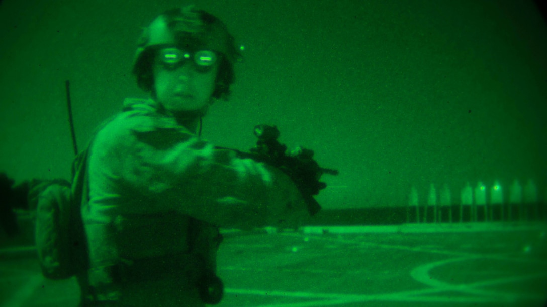 Cpl. Luke Hummel, a reconnaissance Marine with the Maritime Raid Force, 11th Marine Expeditionary Unit, looks over his shoulder to “search and assess” his surroundings during a live-fire shoot on the flight deck of the USS Somerset (LPD 25), Feb. 10. The purpose of search and assess is to ensure 360 degrees of security and situational awareness at all times. The 11th MEU is currently supporting U.S. 5th Fleet’s mission to promote and maintain stability and security in the region while underway during their West-Pac 16-2 deployment. 