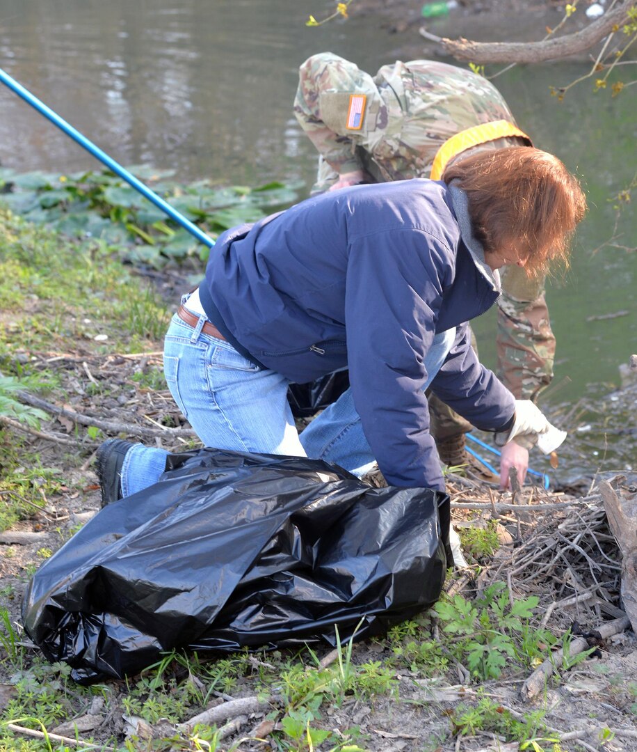 Samantha Carnahan  collects debris from the banks of Salado Creek during the 2017 Basura Bash at Joint Base San Antonio-Fort Sam Houston Saturday, Feb. 18.