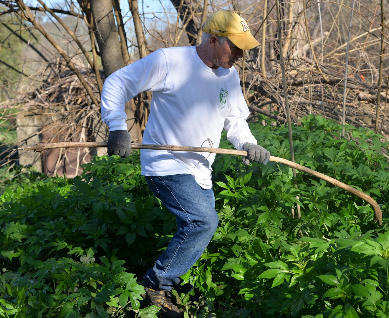 Army Lt. Col. George Cunningham with the physician assistant program combs through the brush at Salado Creek Park during the 2017 Basura Bash at Joint Base San Antonio-Fort Sam Houston Saturday, Feb. 18.