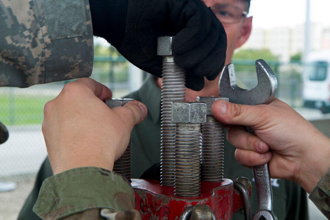 my Reserve Soldiers assigned to the 329th Chemical, Biological, Radiological, and Nuclear (CBRN) Company (Reconnaissance and Surveillance) cap a leak by bolting down a cap on a gas cylinder during training with the Miami-Dade Fire Rescue Department (MDFR) at the MDFR training facility in Doral, Fla., on Feb. 17, 2017. The 329th CBRN Company, from Orlando, Fla., the Army Reserve’s 469th Ground Ambulance Company, from Wichita, Kan., and the Florida National Guard’s Civil Support Team, spent the day training with MDFR firefighters and learned about tools Soldiers could use if called up to support hazardous material operations in Port of Miami and Dade County. (Army Reserve Photo by Master Sgt. Mark Bell / Released)