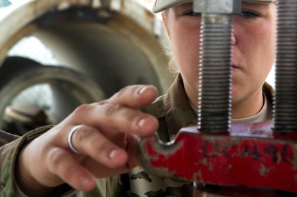 Army Reserve Spc. Angelica Dobrock, who is assigned to the 329th Chemical, Biological, Radiological, and Nuclear (CBRN) Company (Reconnaissance and Surveillance), caps a leak by bolting down cap on a gas cylinder during training with the Miami-Dade Fire Rescue Department (MDFR) at the MDFR training facility in Doral, Fla., on Feb. 17, 2017. Dobrock, who has been in the Army Reserve eight years, is a CBRN specialist from Lake Wales, Fla. The 329th CBRN Company, the Army Reserve’s 469th Ground Ambulance Company, from Wichita, Kan., and the Florida National Guard’s Civil Support Team, spent the day training with MDFR firefighters and learned about tools Soldiers could use if called up to support hazardous material operations in Port of Miami and Dade County. (Army Reserve photo by Master Sgt. Mark Bell / Released)