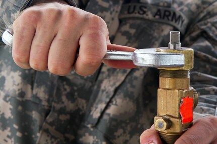 Army Reserve Cadet Peter Hernandez, who is assigned to the 329th Chemical, Biological, Radiological, and Nuclear (CBRN) Company (Reconnaissance and Surveillance), tightens the stem on a gas cylinder during training with the Miami-Dade Fire Rescue Department (MDFR) at the MDFR training facility in Doral, Fla., on Feb. 17, 2017. Hernandez, 20, is from Orlando, Fla. The 329th CBRN Company from Orlando, the Army Reserve’s 469th Ground Ambulance Company, from Wichita, Kan., and the Florida National Guard’s Civil Support Team, spent the day training with MDFR firefighters and learned about tools Soldiers could use if called up to support hazardous material operations in Port of Miami and Dade County. (Army Reserve photo by Master Sgt. Mark Bell / Released)