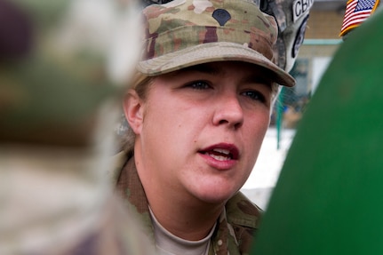 Army Reserve Spc. Angelica Dobrock, who is assigned to the 329th Chemical, Biological, Radiological, and Nuclear (CBRN) Company (Reconnaissance and Surveillance), listens to Miami-Dade Fire Rescue Department (MDFR) firefighters on how to cap a leak on a one-ton gas cylinder at the MDFR training facility in Doral, Fla., on Feb. 17, 2017. Dobrock, who has been in the Army Reserve eight years, is a CBRN specialist from Lake Wales, Fla. The 329th CBRN Company, from Orlando, Fla., the Army Reserve’s 469th Ground Ambulance Company, from Wichita, Kan., and the Florida National Guard’s Civil Support Team, spent the day training with MDFR firefighters and learned about tools Soldiers could use if called up to support hazardous material operations in Port of Miami and Dade County. (Army Reserve photo by Master Sgt. Mark Bell / Released)