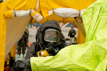 An Army Reserve Soldier uses a multiple gas monitor on a Soldier who has returned from a contaminated shipping container through the decontamination site during joint training with the Miami-Dade Fire Rescue Department (MDFR), at the Port of Miami on Feb. 18, 2017 in Miami, Fla. The 329th Chemical, Biological, Radiological, and Nuclear (CBRN) Company (Reconnaissance and Surveillance), from Orlando, Fla., the Army Reserve’s 469th Ground Ambulance Company, from Wichita, Kan., and the Florida National Guard’s Civil Support Team, spent the day training with MDFR firefighters during a sustainment training exercise that combines civil authorities and Defense CBRN Response Force. The Miami event was the second training exercise of its kind for Northern Command. The first exercise held with a municipality was in New York City. The 329th CBRN Company is the only chemical company on the DCRF. The DCRF mission is to save lives, mitigate human suffering and facilitate recovery operations in a CBRN environment. The DCRF consists of 5,200 personnel to include Soldiers, Sailors, Airmen, Marines and civilians from active-duty and reserve component units. The DCRF is a scalable force that is part of a larger collaborative response capability between local, state, tribal and federal agencies. DCRF assets are used to support the primary agency in the event of a CBRN incident. (Army Reserve photo by Master Sgt. Mark Bell / Released)