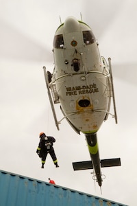 Lt. Christopher Pecori, a flight medic with the Miami-Dade Fire Rescue Department (MDFR), watches Army Reserve Soldiers with patching a hole in a hazardous material container at the Port of Miami during a joint hazard material exercise with the Army Reserve’s 329th Chemical, Biological, Radiological, and Nuclear (CBRN) Company (Reconnaissance and Surveillance) on Feb. 18, 2017 in Miami, Fla. (Army Reserve photo by Master Sgt. Mark Bell / Released)