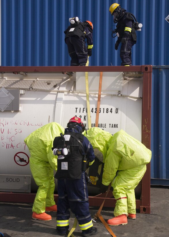 Army Reserve Soldiers and firefighters assigned to the Miami-Dade Fire Rescue Department (MDFR) work together to seal a hole in tank containing hazardous material during joint training with the MDFR at the Port of Miami on Feb. 18, 2017 in Miami, Fla. The 329th Chemical, Biological, Radiological, and Nuclear (CBRN) Company (Reconnaissance and Surveillance), from Orlando, Fla., the Army Reserve’s 469th Ground Ambulance Company, from Wichita, Kan., and the Florida National Guard’s Civil Support Team, spent the day training with MDFR firefighters during a sustainment training exercise that combines civil authorities and Defense CBRN Response Force. The Miami event was the second training exercise of its kind for Northern Command. The first exercise held with a municipality was in New York City. The 329th CBRN Company is the only chemical company on the DCRF. The DCRF mission is to save lives, mitigate human suffering and facilitate recovery operations in a CBRN environment. The DCRF consists of 5,200 personnel to include Soldiers, Sailors, Airmen, Marines and civilians from active-duty and reserve component units. The DCRF is a scalable force that is part of a larger collaborative response capability between local, state, tribal and federal agencies. DCRF assets are used to support the primary agency in the event of a CBRN incident. (Army Reserve photo by Master Sgt. Mark Bell / Released)