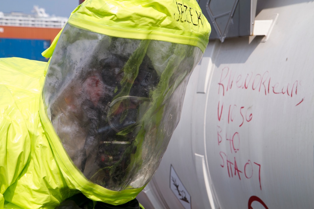 An Army Reserve Soldier examines a hole on a tank containing hazardous materials during a joint HAZMAT training exercise with the Miami-Dade Fire Rescue Department (MDFR) at the Port of Miami on Feb. 18, 2017, in Miami, Fla. The 329th Chemical, Biological, Radiological, and Nuclear (CBRN) Company (Reconnaissance and Surveillance), from Orlando, Fla., the Army Reserve’s 469th Ground Ambulance Company, from Wichita, Kan., and the Florida National Guard’s Civil Support Team, spent the day training with MDFR firefighters during a sustainment training exercise that combines civil authorities and Defense CBRN Response Force. The Miami event was the second training exercise of its kind for Northern Command. The first exercise held with a municipality was in New York City. The 329th CBRN Company is the only chemical company on the DCRF. The DCRF mission is to save lives, mitigate human suffering and facilitate recovery operations in a CBRN environment. The DCRF consists of 5,200 personnel to include Soldiers, Sailors, Airmen, Marines and civilians from active-duty and reserve component units. The DCRF is a scalable force that is part of a larger collaborative response capability between local, state, tribal and federal agencies. DCRF assets are used to support the primary agency in the event of a CBRN incident. (Army Reserve photo by Master Sgt. Mark Bell / Released)