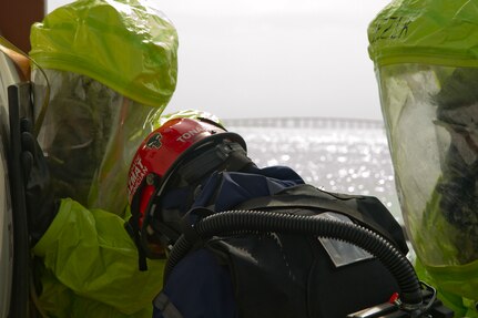 An Army Reserve Soldier uses his body weight to hold a patch to seal a hole on a tank containing hazardous materials during a joint HAZMAT training exercise with the Miami-Dade Fire Rescue Department (MDFR) at the Port of Miami on Feb. 18, 2017 in Miami, Fla. The 329th Chemical, Biological, Radiological, and Nuclear (CBRN) Company (Reconnaissance and Surveillance), from Orlando, Fla., the Army Reserve’s 469th Ground Ambulance Company, from Wichita, Kan., and the Florida National Guard’s Civil Support Team, spent the day training with MDFR firefighters during a sustainment training exercise that combines civil authorities and Defense CBRN Response Force. The Miami event was the second training exercise of its kind for Northern Command. The first exercise held with a municipality was in New York City. The 329th CBRN Company is the only chemical company on the DCRF. The DCRF mission is to save lives, mitigate human suffering and facilitate recovery operations in a CBRN environment. The DCRF consists of 5,200 personnel to include Soldiers, Sailors, Airmen, Marines and civilians from active-duty and reserve component units. The DCRF is a scalable force that is part of a larger collaborative response capability between local, state, tribal and federal agencies. DCRF assets are used to support the primary agency in the event of a CBRN incident. (Army Reserve photo by Master Sgt. Mark Bell / Released)