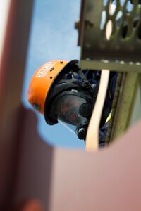 Capt. Jeff Suarez, the Air Rescue Bureau Manager with the Miami-Dade Fire Rescue Department (MDFR), assists Army Reserve Soldiers with patching a hole in a hazardous material container at the Port of Miami during a joint hazard material exercise with the Army Reserve’s 329th Chemical, Biological, Radiological, and Nuclear (CBRN) Company (Reconnaissance and Surveillance) on Feb. 18, 2017 in Miami, Fla. The 329th CBRN Company, from Orlando, Fla., the Army Reserve’s 469th Ground Ambulance Company, from Wichita, Kan., and the Florida National Guard’s Civil Support Team, spent the day training with MDFR firefighters during a sustainment training exercise that combines civil authorities and Defense CBRN Response Force. The Miami event was the second training exercise of its kind for Northern Command. The first exercise held with a municipality was in New York City. The 329th CBRN Company is the only chemical company on the DCRF. The DCRF mission is to save lives, mitigate human suffering and facilitate recovery operations in a CBRN environment. The DCRF consists of 5,200 personnel to include Soldiers, Sailors, Airmen, Marines and civilians from active-duty and reserve component units. The DCRF is a scalable force that is part of a larger collaborative response capability between local, state, tribal and federal agencies. DCRF assets are used to support the primary agency in the event of a CBRN incident. (Army Reserve photo by Master Sgt. Mark Bell / Released)