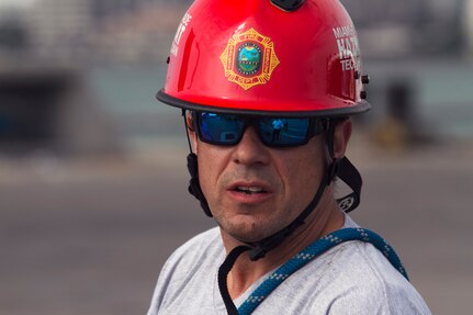 Lt. Christopher Pecori, a flight medic with the Miami-Dade Fire Rescue Department (MDFR), watches Army Reserve Soldiers with patching a hole in a hazardous material container at the Port of Miami during a joint hazard material exercise with the Army Reserve’s 329th Chemical, Biological, Radiological, and Nuclear (CBRN) Company (Reconnaissance and Surveillance) on Feb. 18, 2017 in Miami, Fla. The 329th CBRN Company, from Orlando, Fla., the Army Reserve’s 469th Ground Ambulance Company, from Wichita, Kan., and the Florida National Guard’s Civil Support Team, spent the day training with MDFR firefighters during a sustainment training exercise that combines civil authorities and Defense CBRN Response Force. The Miami event was the second training exercise of its kind for Northern Command. The first exercise held with a municipality was in New York City. The 329th CBRN Company is the only chemical company on the DCRF. The DCRF mission is to save lives, mitigate human suffering and facilitate recovery operations in a CBRN environment. The DCRF consists of 5,200 personnel to include Soldiers, Sailors, Airmen, Marines and civilians from active-duty and reserve component units. The DCRF is a scalable force that is part of a larger collaborative response capability between local, state, tribal and federal agencies. DCRF assets are used to support the primary agency in the event of a CBRN incident. (Army Reserve photo by Master Sgt. Mark Bell / Released)