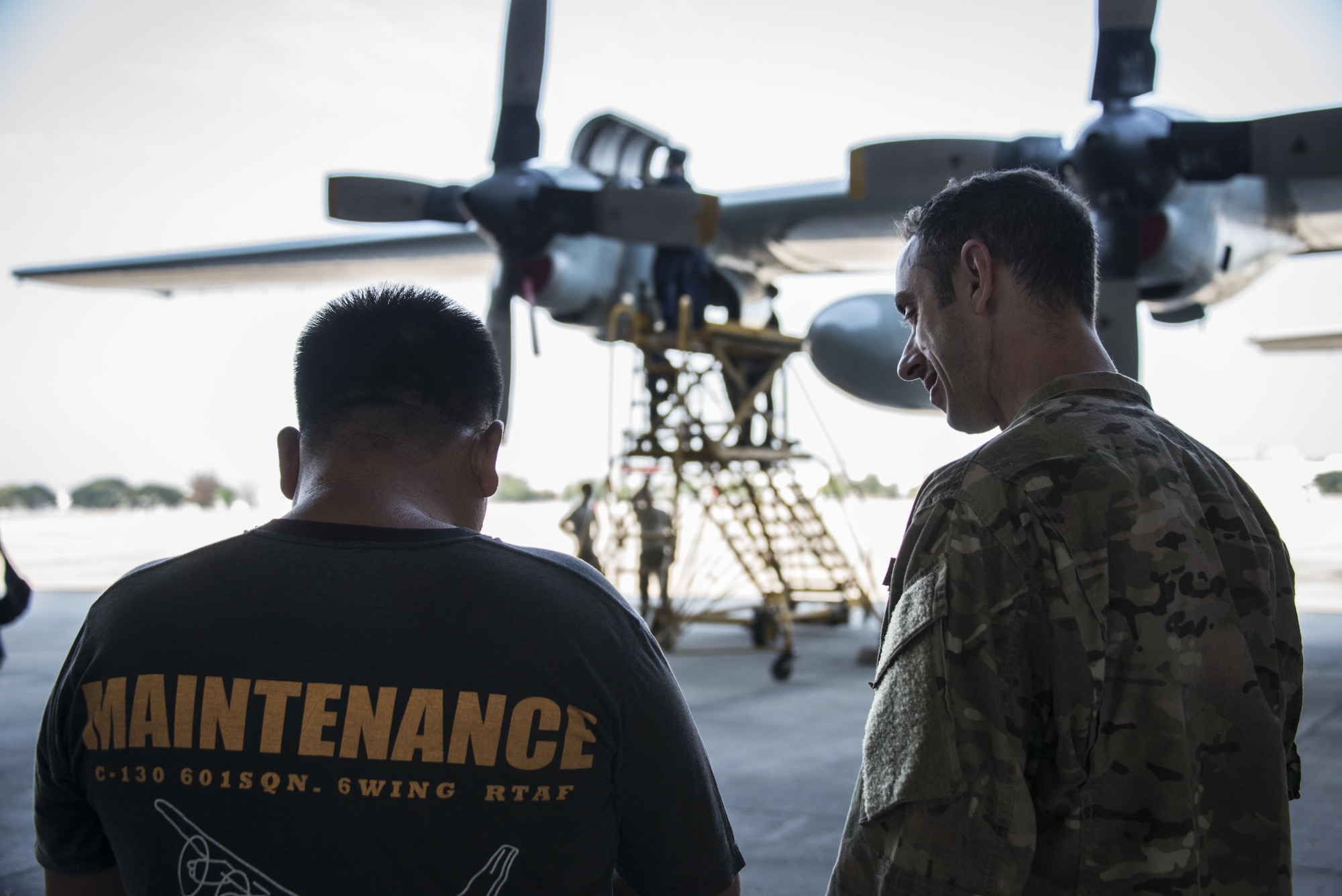 U.S. Air Force Master Sgt. Andrew Finesilver, 353rd Special Operations Maintenance Squadron production superintendent, engages with his Royal Thai Air Force counterpart from the 601st Squadron Maintenance Team, Feb. 8, 2017 at Don Mueang Air Base, Thailand. Leading up to Cobra Gold 2017, members of the 353rd SOMXS strengthened the long-standing partnership with the Royal Thai Air Force through a maintenance exchange, Feb. 6-9, 2017. (U.S. Air Force photo by Capt. Jessica Tait)