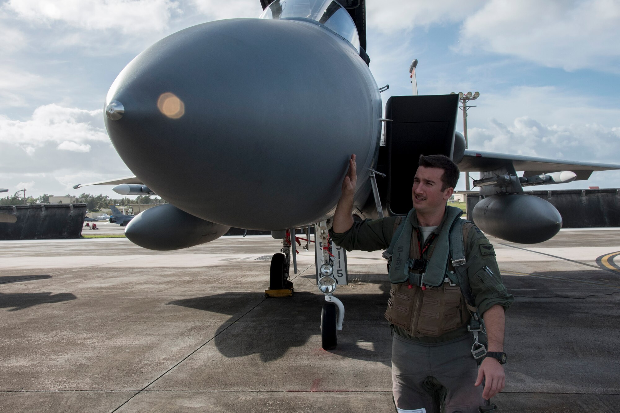 U.S. Air Force Capt. Lance Coldren, 67th Fighter Squadron F-15 Eagle pilot, conducts a pre-flight inspection during annual exercise Cope North Feb. 20, 2017, at Andersen Air Force Base, Guam. Cope North provides opportunities for aviators from the U.S. Air Force, U.S. Navy, Japan Air Self-Defense Force and Royal Australian Air Force to practice combat scenarios in a controlled environment to improve tactics and cohesion among allied units. (U.S. Air Force photo by Senior Airman John Linzmeier/released)