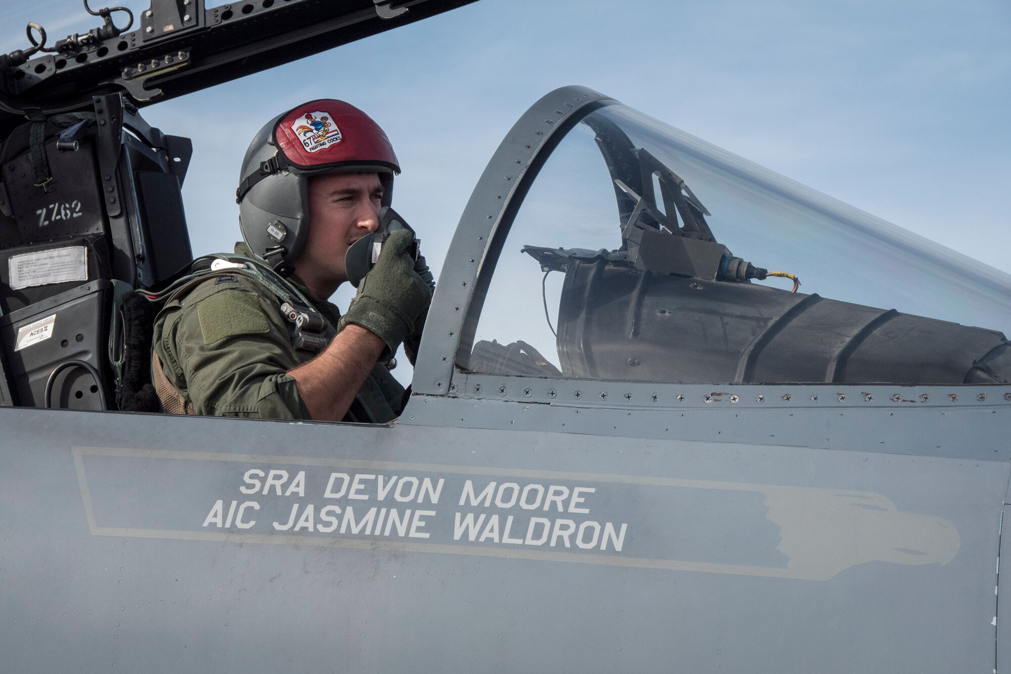 U.S. Air Force Capt. Lance Coldren, 67th Fighter Squadron F-15 Eagle pilot, secures his oxygen mask in preparation for a flight during annual exercise Cope North Feb. 20, 2017, at Andersen Air Force Base, Guam. Cope North is an annual exercise which serves as a keystone event to promote stability and security throughout the Indo-Asia Pacific by enabling regional forces to hone vital readiness skills. (U.S. Air Force photo by Senior Airman John Linzmeier/released)