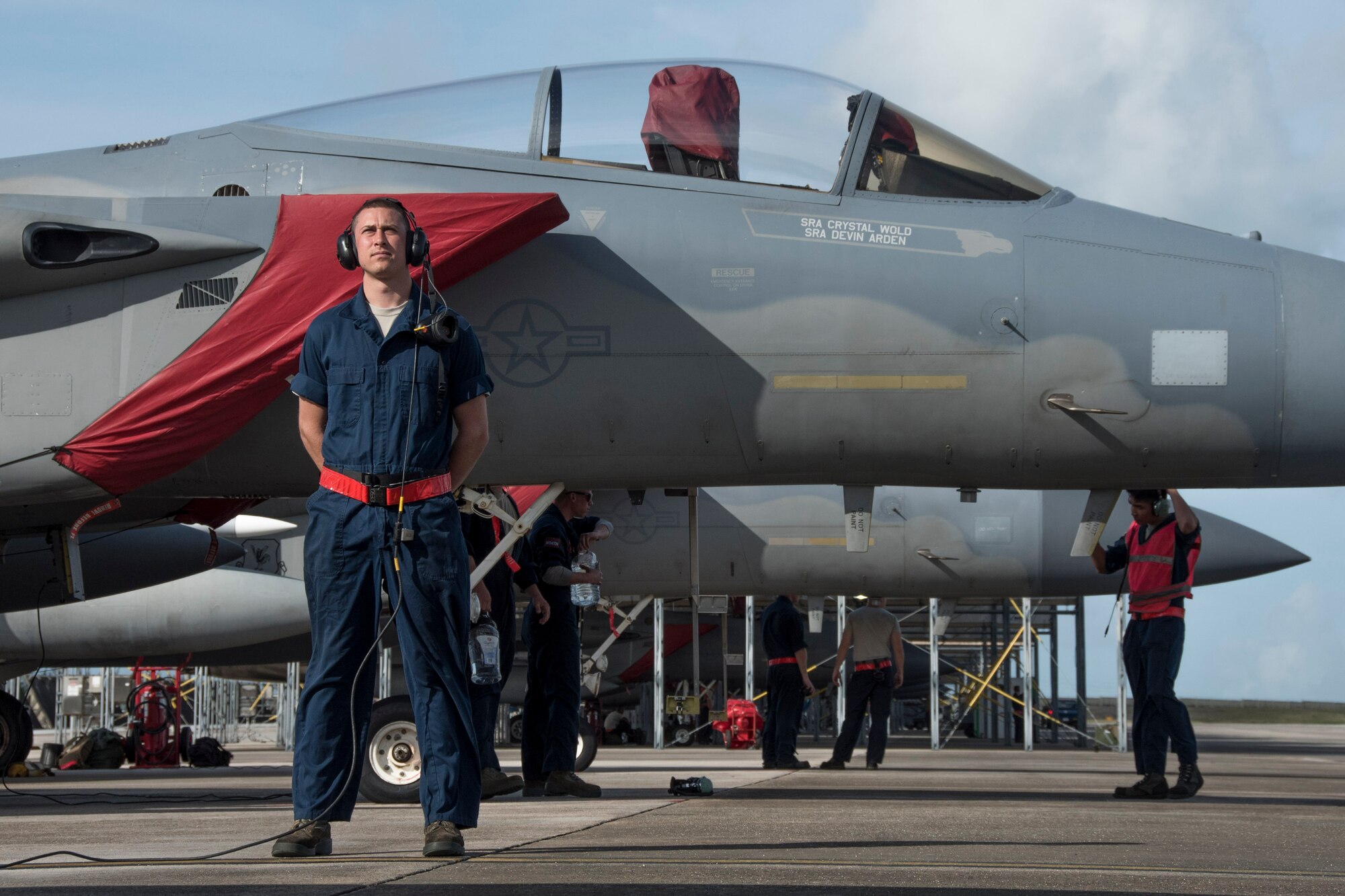 U.S. Air Force Airman 1st Class Andrew Tarnutzer, 67th Aircraft Maintenance Unit crew chief, awaits for an F-15 Eagle pilot to start his aircraft’s engine during annual exercise Cope North Feb. 20, 2017, at Andersen Air Force Base, Guam. Maintenance Airmen keep aircraft running safely and effectively which enables Pacific Air Force units, such as the 67th FS, to provide protection and stability throughout the Indo-Asia Pacific. (U.S. Air Force photo by Senior Airman John Linzmeier/released)